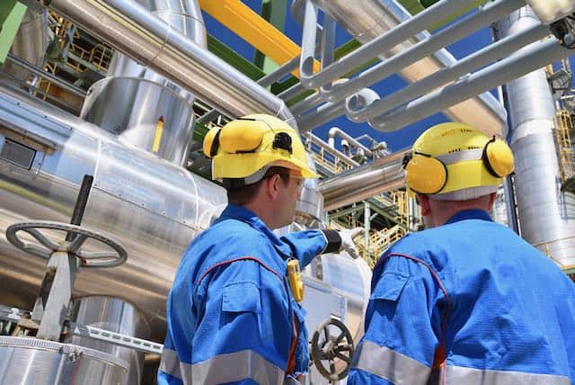 3-way communication, workers at a refinery, licensed from CANVA